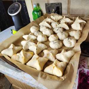 A tray of homemade bao with several fillings