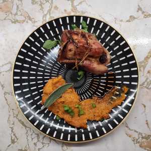 Plate of roast quail and berbere sweet potato